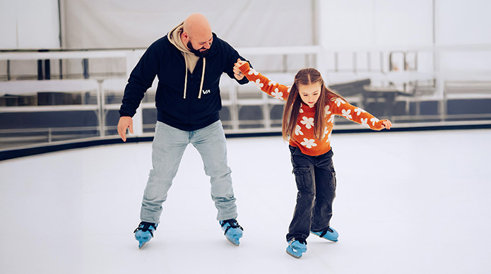 Ice skating father and daughter in north bend, oregon