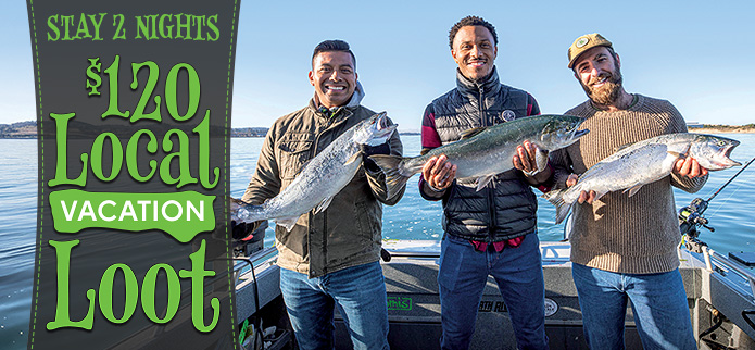 three men holding salmon on a fishing charter and Local Vacation Loot Logo